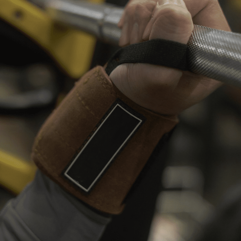 Présentation de la Bande Poignet Cuir, idéale pour tous les types d'exercices de musculation.