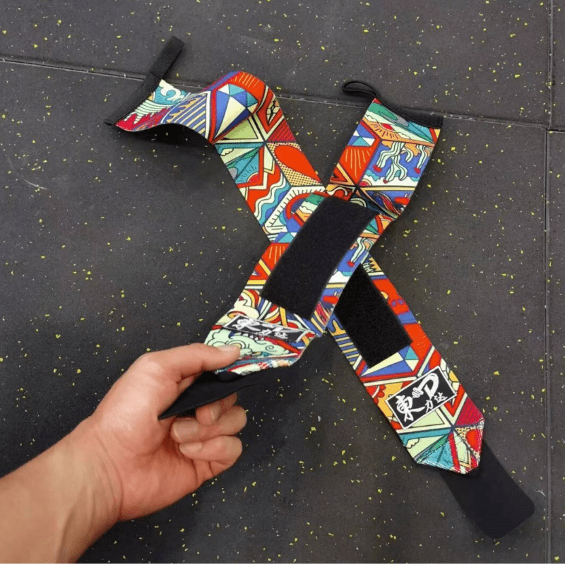 Bande Poignet Graffiti robuste et colorée, conçue pour offrir un soutien optimal du poignet pendant vos séances d'entraînement intenses.