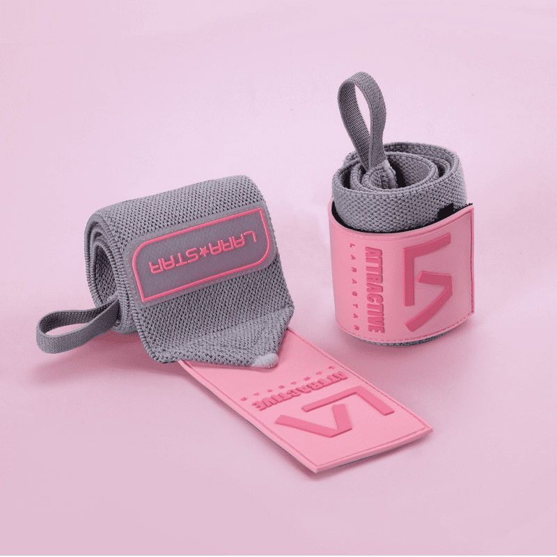 Bande Poignet Rose/Gris, l'accessoire de fitness tendance qui assure un soutien optimal pour ton poignet.
