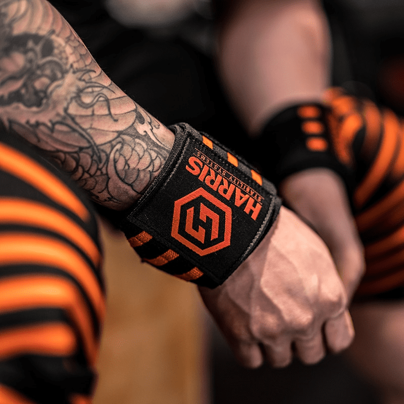 Accessoire idéal pour la musculation, la Bande Poignet Black Amber offre confort, support et un look élégant.