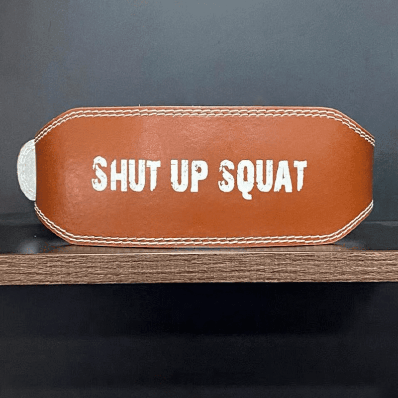 "Ceinture de Musculation Squat 'SHUT UP SQUAT' en cuir PU robuste pour soutenir les squats intenses."