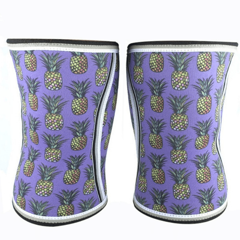 Genouillère Haltérophilie Pineapple offrant un soutien robuste pour les levées lourdes, avec un design amusant et tropical d'ananas.