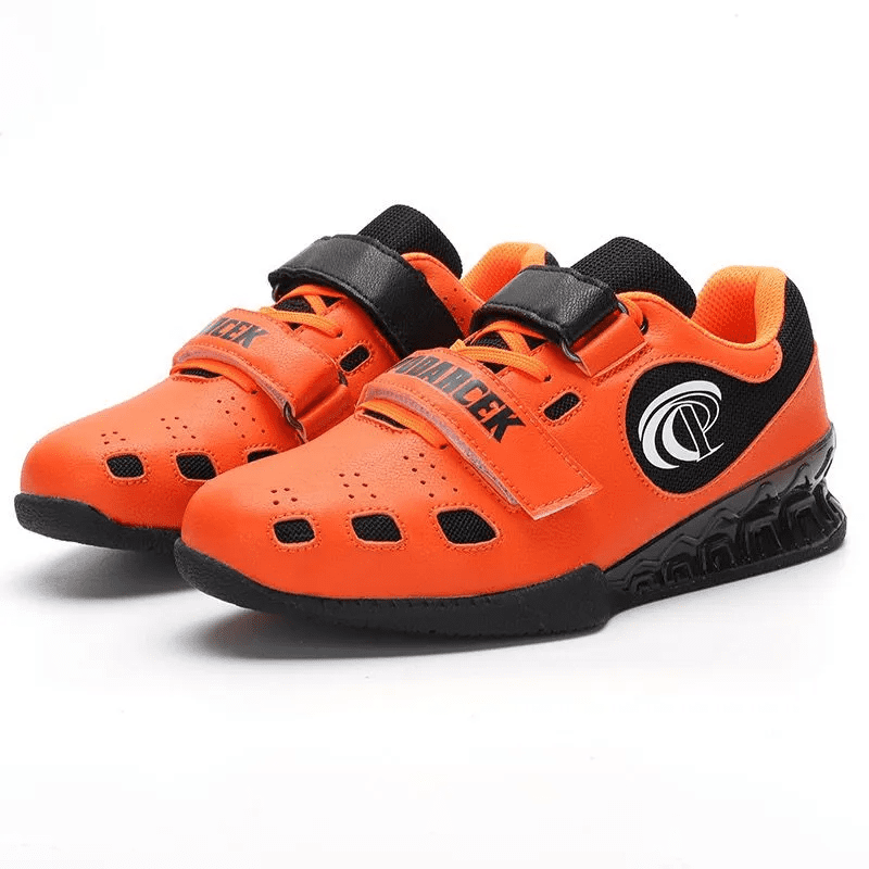 "Chaussures Powerlifting en orange, combinant confort et performance."