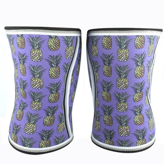 Genouillère Haltérophilie Pineapple offrant un soutien robuste pour les levées lourdes, avec un design amusant et tropical d'ananas.